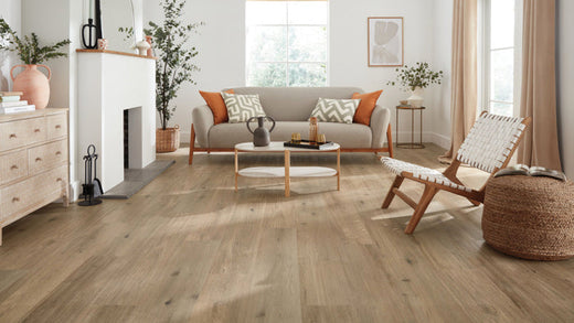 Cozy living room featuring Karndean Canadian Urban Oak flooring, complemented by white walls and warm wood accents.